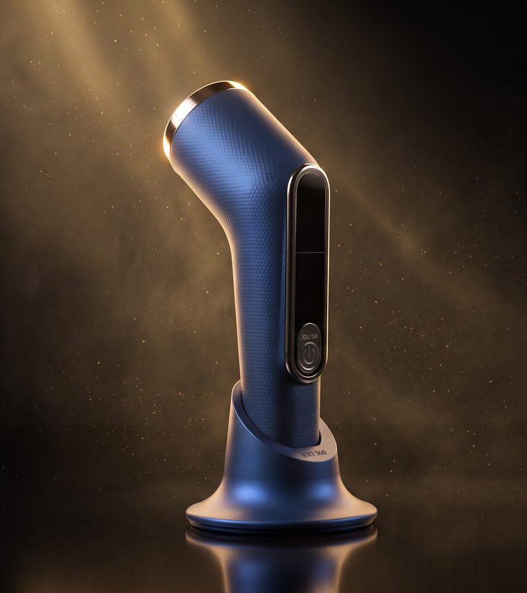 The Joli 360, a deep blue crosshatch device with a curved neck and steel cap, docked on its base